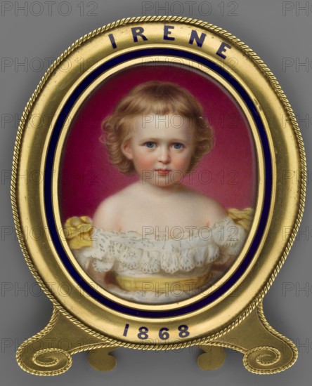 Irene von Hesse und bei Rhein 1866–1953, daughter of Louis IV of Hesse, portrayed as a girl; after a miniature by Reginald Easton 1807–1893. Portrait miniature, England, 1868. Subjects: children, girls, rulers. Medium: miniature; dimensions: height 8.1 cm, width 6.7 cm., An oval framed portrait of a young child with light brown curly hair and blue eyes, wearing a white lace dress with yellow ribbon details, set against a deep pink background; the portrait is enclosed in a gold frame with dark blue accents and a decorative rope-like edge, all shown on a gray surface.