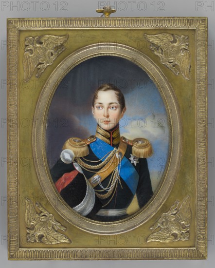 Alexander II Romanov 1808–1881, Tsar of Russia; painted by Ivan Winberg fl. 1800–1851. Miniature portrait height 17.2 cm, width 13.2 cm. Depicts boys, rulers, soldiers in uniforms and orders; male portrait with landscape and sky background. Dated 1834. Associated with Hessen and bei Rhein, Ernst Ludwig Grossherzog; 1868–1937 provenance/repossessions noted. Origin: Russia., A painted oval portrait set in an ornate rectangular gold frame shows a young person with fair skin and short brown hair wearing a dark military uniform with gold epaulettes, blue sash, and multiple gold cords and medals; the face has a neutral expression and light-colored eyes, and the background inside the oval shows cloudy sky tones in blue and gray. The surrounding frame is metallic gold with decorative raised corner motifs depicting stylized winged figures and a textured border, and visible colors include gold, blue, black, brown, red, white, gray, and muted flesh tones.