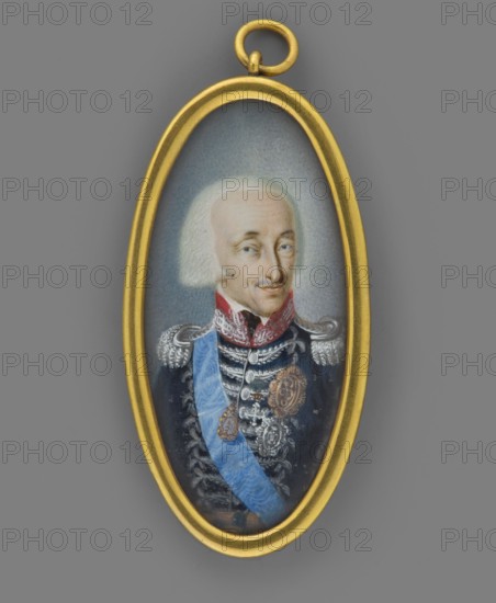 Victor Emmanuel I 1759–1824, King of Sardinia and Piedmont, Duke of Aosta; standing waist-length, head to the right. Grey wig revealing the forehead and combed over the ears. White shirt collar, navy blue uniform with red collar, rich silver braiding and epaulettes; blue sash on the left shoulder; on the right breast the orders of St. Maurice, St. Lazarus and the Annunciade with a ribbon. Background: grayish-blue. Gilded bronze medallion binding. 1800, Italy. Miniature; height 4.5 cm, width 2.0 cm. Unknown artist. Portrait; male, ruler, soldier; orders., An oval pendant with a gold frame contains a painted portrait of an older person with pale skin and white hair wearing a dark blue uniform with silver braided details and epaulettes, a red collar, and a light blue sash across the chest; the portrait background is a muted gray-blue and the pendant is set against a solid gray surface, with visible colors including gold, blue, red, silver, white, pale flesh tones, and gray.