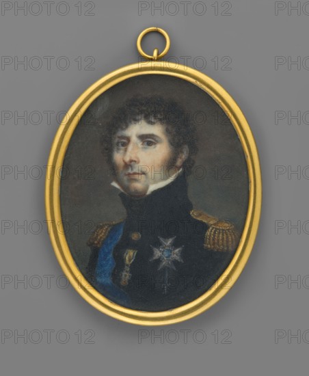 Charles XIV Bernadotte, King of Sweden 1763–1844, painted by François Gérard 1770–1837 and an unknown painter, ca. 1815. Miniature portrait height 6.2 cm, width 5.0 cm depicting a male ruler in uniform and orders including the Order of the Golden Fleece; portrait of a commander/politician., An oval pendant with a gold frame contains a painted portrait of a man shown from the chest up wearing a dark uniform with gold epaulets and decorative insignia, including a star-shaped badge and a sash; his face has pale skin tones, dark curly hair, and sideburns, and he looks toward the viewer with a neutral expression. The portrait background is muted dark gray and green, and the outer background surrounding the pendant is medium gray. Colors visible include gold, dark blue, black, pale flesh tones, dark brown, gray, and green.