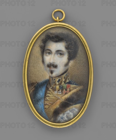 Oscar I Bernadotte 1799–1859, king of Sweden and Norway; anonymous creator; male portrait miniature ca. 1815; subject depicted in orders and uniform; height 4.8 cm, width 3.2 cm; inscriptions/notes: commanders, politicians., An oval pendant with a gold frame hangs against a gray background, containing a painted portrait of a man with dark curly hair and a mustache and small goatee, his skin shown in pale tones and his eyes rendered in muted blue-gray; he wears an ornate uniform with a deep blue sash, gold decorative braiding, and small accents of red and green, and a fur-edged garment in dark brown near the lower portion of the image.
