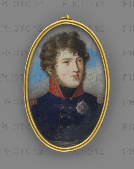 Charles Louis of Baden 1786–1818, Prince of Baden, son of Charles Louis and Amalia Frederick of Hesse-Darmstadt; male portrait in uniform with orders; commander/soldier; miniature, ca. 1812; height 6.0 cm, width 3.8 cm; painter unknown., An oval pendant with a gold frame contains a painted portrait of a young person with curly brown hair and light skin, shown from the shoulders up against a cloudy blue and gray background; the subject wears a dark blue military-style coat with a high red collar and gold details on the shoulders, and there is a decorative star-shaped badge on the chest. The visible colors include gold, brown, light skin tones, dark blue, red, blue, gray, and black.