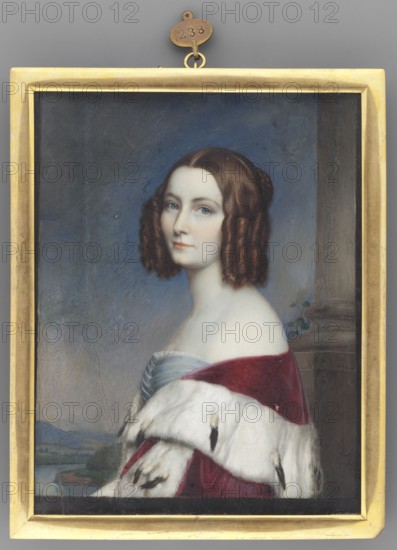 Marie Amalie Elisabeth Karoline von Baden 1817–1888, Duchess of Hamilton, called Maria Amalia. Portrait woman, waist-length, torso almost in profile, head three-quarters to the left. Dark hair parted in the middle with angular lace at the sides. She wears a blue-gray dress with a bustle and a collar at the neckline; a dark red cloak trimmed with ermine is slipped over the shoulders. Background: a column at right, a gray-green landscape at left, and a gray-blue sky above. Miniature, gilded bronze frame, ca. 1840; height 15.5 cm, width 12.9 cm. Creators attributed: Peter, Emanuel 1799–1873; Stieler, Joseph Karl 1781–1858; Cittadini, Alessandro 1820–1877., A framed portrait of a young woman shown from the chest up, facing slightly to the viewer's left, with pale skin and brown hair styled in curled ringlets; she wears a strapless dress with a bluish-gray bodice and a deep red cloak edged with white fur that has dark spots; the background includes a muted blue-gray sky and a hint of a land...