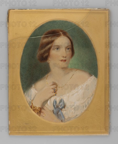 Duchess of Hamilton, Maria Amelia von Baden, Duchess of Baden 1817-1888, painted by Martens fl. 1850-1870 painter. Shoulder-length, right, portrait; woman young, ruler princess. Bust, 3/4 right. Blond hair, grey-blue eyes, gold round earrings, gold chain around her neck. White dress with a blue-violet bow. Gold bracelets and rings with sapphires and diamonds on her hand. Background: left blue-gray-brown, right gray-blue and celadon in the lower part of the face and arm. No frame. 1850, Paris. Miniature, 11.2 cm high x 8.3 cm wide., repossession Jelenia Góra., A painted portrait of a woman set within an oval frame on a rectangular background, showing a person with brown hair styled in a low updo and fair skin, wearing a white off-the-shoulder dress with a blue ribbon accent and gold jewelry including a delicate necklace, earrings, a ring, and a bracelet; the oval interior has a dark green background while the surrounding rectangular area is a warm ochre color with subtle decorative impr...