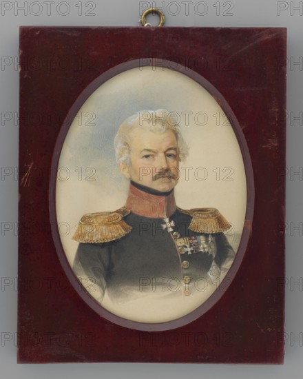 Feodor Friedrich Karl Count Nesselrode 1786–1869, father of Maria Kalergis, Russian general, adjutant of Grand Duke Constantine, son of diplomat Karl Francis. Painted by Stanislaw Marszalkiewicz 1789–1872. Miniature portrait, March 1840. Bust 3/4 right. Short, slightly wavy gray hair, brown mustache; black cravat at neck; black uniform with high red collar, gold buttons and epaulets; wearing four crosses and two stars of orders Order of the Red Eagle, Order of St. Anne, Order of St. George, Order of St. Vladimir, Order of St. Stanislaus, Order of the White Eagle, Order of the Sword. Background: sky near the head, lightly underlined with blue. Rectangular mahogany frame with oval cutout and hanging ring. Miniature, height 14.7 cm, width 10.8 cm., An oval portrait of a man with light blond hair and a mustache set in a rectangular dark reddish-brown wooden frame with a small metal hanging loop at the top; the man wears a dark uniform with a high red collar and gold fringed shoulder epaule...