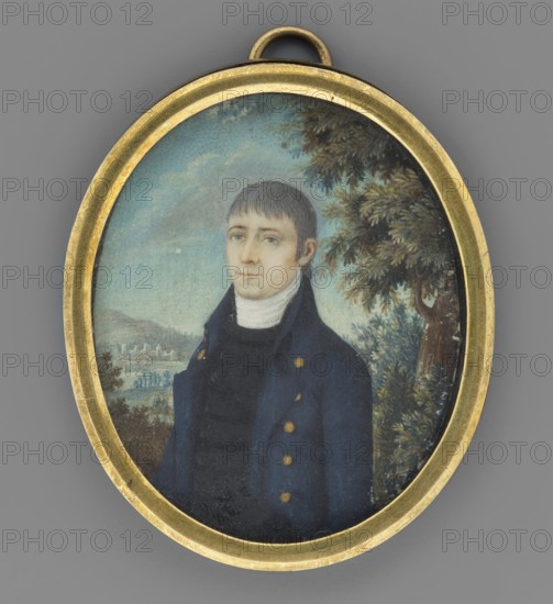 Portrait of a man, unknown painter, Krzeszowice Lesser Poland Voivodeship, plants, trees, man, three-quarter portrait, sky, male portrait, miniature, 1803, height 6.1 cm, width 4.9 cm, An oval pendant with a gold-colored metal frame contains a painted portrait of a young man shown from the chest up, wearing a dark blue coat with gold-colored buttons and a high white collar; he has short brown hair and a pale complexion with a neutral expression. The background shows a light blue sky with soft clouds, a leafy green tree to the right, and a distant landscape with muted green and brown tones. The frame and loop at the top are gold-colored, and the overall image includes shades of blue, green, brown, gold, white, and pale skin tones.
