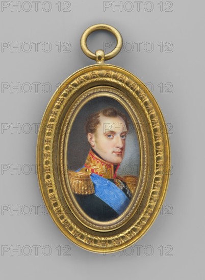 Nicholas I Romanov 1796–1855, Tsar of Russia; painted by Ivan Winberg fl. 1800–1851; subject: men, uniforms, orders, male portrait, ruler; portrait en three-quarters; soldiers; foreign miniature; iconography of Nicholas I; dated 1830, St. Petersburg; miniature; height 4.5 cm, width 2.8 cm., An oval gold pendant with a decorative loop at the top encloses a small painted portrait of a man shown from the shoulders up; the man has light skin, short brown hair, and a neutral expression, and he wears a dark military-style coat with ornate gold epaulettes, a red and gold collar, and a bright blue sash across his chest; the portrait is set against a muted gray background and the pendant frame is richly detailed with carved patterns in gold.