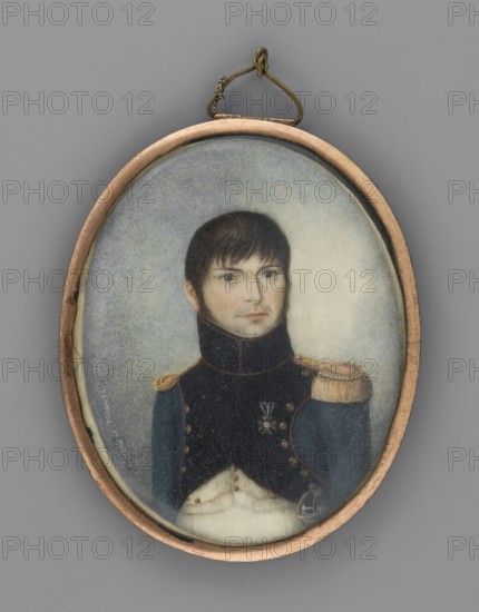 Milewski?, lieutenant of the infantry artillery of the Duchy of Warsaw, unknown artist possibly amateur painter. Subject: male portrait in three-quarters, Polish miniature soldier. Date: 1811. Torso slightly to the left, head slightly to the right. Dark brown hair and sideburns, blue eyes. Navy blue uniform with black collar and rebates with red piping and gold buttons; gold epaulettes; Virtuti Militari cross; white vest and trousers; silver saber pommel. Background: gray-blue-yellowish, brightened on the right. Binding: oval rim of semi-convex gilt-bronze bar, convex glass. Inscription along the left edge: Souvenir de Milewski. 1811. Inscription on reverse of binding: officer of infantry artillery/priest of Warsaw. Type: miniature. Dimensions: height 6.5 cm, width 5.2 cm. Place of origin: Poland; Duchy of Warsaw 1807–1815. Attribution after Dubois; referenced in Tygodnik Ilustrowany, W. 1922, I. no. 8, ill. p. 120., An oval framed portrait of a man shown from the chest up, set against...