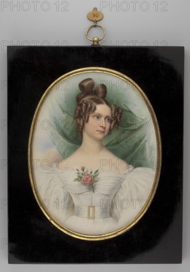 Duchess Mathilde of Bavaria Mathilde Karoline von Bayern, von Hessen-Darmstadt, Grand Duchess of Hesse, 1813–1862. Portrait to the waist, right of a young woman, painted 1835 in the Biedermeier style; miniature, 15.9 × 12.2 cm. Artists: Joseph Karl Stieler 1781–1858 and Stanislaw Marszalkiewicz 1789–1872 according to the opinion of A. Chamiec. Subject details: ruler king's daughter, prince's wife, romantic dress with puffed leg-of-mutton sleeves, rose bouquet at the bodice, shinion headgear. Repossession provenance., A framed oval portrait of a woman set against a dark rectangular background with a small metal hanging loop at the top; the woman has fair skin and brown hair styled in elaborate curls and loops, a few ringlets framing her face, and she wears a white off-the-shoulder gown with puffed sleeves and a fitted bodice featuring a light-colored belt with a decorative buckle; a pink rose with green leaves is pinned at her chest and a soft green drapery hangs behind her, with subtle...