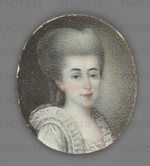 Portrait of a Lady in a White Dress and a High Powdered Wig, unknown painter; woman wearing a powdered wig; 3/4 right portrait; foreign miniature; provenance includes repossession Jelenia Góra; ca. 1780; miniature; height 3.9 cm, width 3.4 cm, An oval-painted portrait of a woman with pale skin and gray hair styled high, wearing a ruffled light-colored dress; her face shows blue eyes and subtle pink lips and cheeks, set against a textured background that transitions from dark gray at the edges to a lighter gray near her head, with visible tones of white, light blue, pink, and brown in the painting and a surrounding matte medium-gray border.