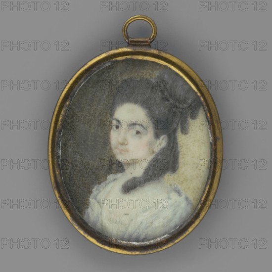 Portrait of a woman in a white dress by Grzegorz Sachowicz 1819–1877, photographic studio, portrait en trois-quarts, female portrait, Polish miniature, 1850–1870. Bust three-quarter left. Dark hair tied in a high knot and girded with a braid, with a wide strand ending in a tubular curl on the neckline and shoulder. Shawl and dress pale blue, low-cut, with a finely pleated ruffle at the bodice. Background stippled, dark olive, yellowish on the right and much lighter. Frame: narrow, semi-convex oval rim made of gilded bronze mostly worn. Miniature, height 3.9 cm, width 3.2 cm. On the reverse: inscription: Owner: Sakowicz; April 23, 1917., An oval pendant with a thin gold-colored metal frame contains a small painted portrait of a young woman shown from the shoulders up, facing slightly toward the viewer. The woman has dark hair styled up with a loose strand at the neck and a dark decorative element at the back of her head, pale skin, and a neutral expression. She wears a light-colored, po...