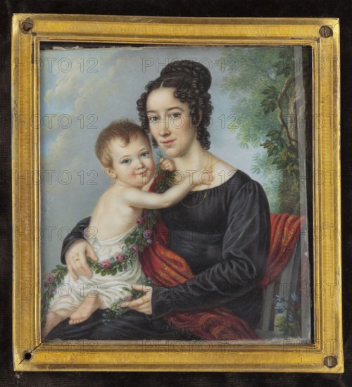 Portrait of a young woman with a child, pendant to the portrait of her husband, sculptor from Wroclaw, Schalck, Heinrich Franz 1791-1832 painter/author; group portrait; woman young, waist-high, left; plants trees, oak leaves, wreath; child little boy; mythological elements cupid, oak leaves, wreath — Bacchus' procession?; boy right, as cupid; interior Empire armchair; landscape sky, oak, park; foreign miniatures;, repossession Jelenia Góra; 1819; miniature; height 9.0 cm; width 8.3 cm, A framed painted portrait shows a seated woman holding a child on her lap; the woman has pale skin, dark braided hair styled up with ringlets at the sides, and she wears a dark long-sleeved dress with a red patterned shawl draped over her. The child has pale skin, short light brown hair, and is partially clothed in a light-colored garment while reaching toward the woman's neck and holding a garland of small flowers and greenery that drapes around both of them. The background includes a cloudy sky on one ...