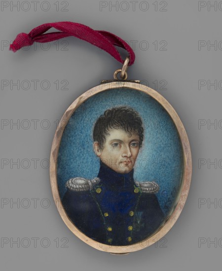 Portrait of Szczepan Siemiatkowski. Miniature portrait, 1817, painted by Felix Stoienski. Three-quarter bust of a man right — dark brown hair, grey eyes. He wears a sapphire uniform with green piping and gold buttons, silver epaulettes, and the Virtuti Militari Cross. Background blue, darker at edges. Medallion frame with oval bronze border. Inscription along right edge: FS 817. Inscription inside binding: Szczepan/Siemiatkowski/Captain of the Grenadier/Guard of the Kingdom/Poland/painted by Felix Stoi-...ienski R. 1817. Miniature, height 4.3 cm, width 3.5 cm., An oval pendant with a metal frame holds a painted miniature of a young man wearing a dark blue military-style coat with bright metallic epaulettes and small round buttons, his face framed by short dark curly hair and a neutral expression; the painted background is a textured blue, the frame is a warm metallic tone, and a twisted ribbon in a deep red is looped through the pendant's top.