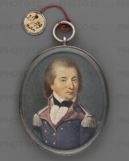 Portrait of the young General Jan Henryk Dabrowski 1755–1818 in uniform based on an image from the palace in Winnogóra Winna Góra, unknown artist, three-quarter portrait. Subject: men, male portrait, soldier, commander of the Napoleonic campaigns 1795–1815, Duchy of Warsaw 1807–1815. Insignia: Order of the White Eagle, Virtuti Militari. Pose: bust left, head turned right. Appearance: brown hair smoothly combed back from forehead and temples; blue eyes; white shirt collar and jabot; black cravat; navy blue uniform with magenta lapels and collar, silver buttons and epaulettes. Background: dark gray. Technique/format: miniature; silver rim set on two beveled crystal glass plates, binding shared with another miniature; height 6.1 cm, width 5.0 cm. Date: 1810. Place of origin: Poland. Provenance unknown., An oval pendant with a painted portrait of a man wearing a dark blue military-style coat with a high collar and epaulettes, a white ruffled shirt, and a black cravat, set against a muted g...