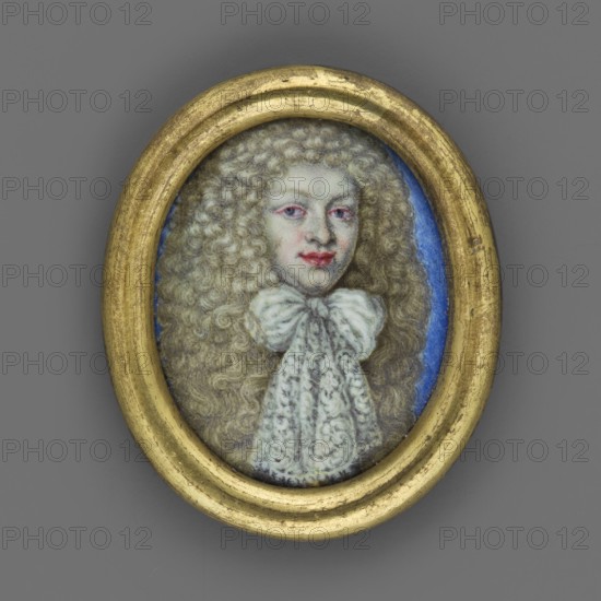 Portrait of a Young Man, Ludwig VII of Hesse-Darmstadt? 1658–1678, unknown artist, male portrait en face, shoulder-length, applied wig with lush lion-style curls, young man, costume with large lace bow at the neck; bust, straight; background light sapphire. Double-profiled brass medallion frame, miniature, ca. 1665–1675, Germany. Height 2.7 cm, width 2.1 cm., An oval portrait set in a worn gold frame shows a figure with long, curly light brown hair and a pale complexion, wearing a large white bow and a patterned white garment; the face has visible pinkish-red on the lips and around the eyes, and the background inside the frame is blue against a gray outer surface.