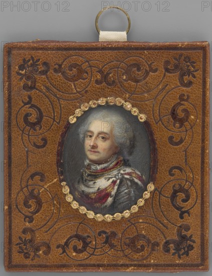 Stanislaw August Poniatowski, King of Poland in the years 1764–1796. Attributed to Bacciarelli; possibly by Johanna Juliana Friederike Bacciarelli 1733–1809/1812 or studio; painted at the Malarnia Królewska Warsaw, art school, 1766–1818. Portrait miniature, bust left, three-quarter male portrait in coronation robes. Gray powdered wig with a katogan. Crimson cloak thrown over armor, embroidered with golden eagles, trimmed with ermine and fastened at the shoulder with a diamond brooch. Background dark, slightly lighter on the right. Binding: light brown leather embossed with darker ornaments; around the oval an embossed pearl ornament made of gilded paper approximately one-third of the pearls missing. Miniature, Poland; height 4.3 cm, width 3.6 cm; dated circa 1800., A small rectangular leather case in shades of brown with darker brown ornamental scrollwork embossed across its surface, featuring an oval painted portrait set into the center surrounded by a decorative ring of small gold-co...