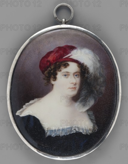 Konstancja Potocka née Konstancja Raczynska 1783–1852, 3/4 bust right; brown hair in short spiral curls; wearing a cherry velvet beret with two grey-white ostrich feathers, sapphire dress, deeply low neckline revealing the shoulders trimmed with a ruffle. Miniature on bone plate underdrawing on reverse, 1807, Poland. Height 8.4 cm, width 6.8 cm. Subjects/tags: aristocracy, women, Polish miniatures, portraits en trois-quarts., An oval pendant with a silver frame showing a painted portrait of a person with pale skin and curly brown hair wearing a red cap adorned with a large white feather, a dark blue garment with a ruffled white neckline, and a muted brownish background; visible colors include red, white, brown, blue, silver, gray, and pale skin tones.