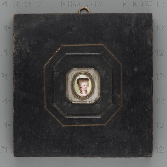Woman's head in a high wig. Portrait en trois-quarts of a woman with a high blond wig trimmed with a white headdress at the top; white trim on a magenta dress at the bodice. Background: yellowish-green. Oval bronze frame set in an octagonal mother-of-pearl plate placed in an octagonal cut of a square black unpolished wooden frame, inlaid with bronze strips. Miniature, dated 1775, height 1.5 cm, width 1.2 cm., Polish miniature; artist possibly Leopold Méyet 1850–1912 noted in association; amateurs;, mentioned., A square dark wooden panel with worn surfaces and a small metal hanging loop at the top surrounds a recessed octagonal frame with layered stepped edges and subtle gold trim; set in the center is a tiny painted portrait of a person with pale skin, high powdered brown hair, pink cheeks and lips, and a visible white cap, all within a small decorative bezel, with colors including black, dark brown, gold, white, pink, brown, beige, and pale green.