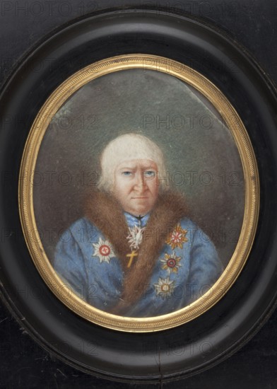 Portrait of the Bishop of Minsk, Jakub Ignacy Dederko 1751–1829, in a blue coat; artist, clergy, en face portrait of a man in costume; Polish miniature; wearing insignia of the Order of St. Stanislaus, Order of St. Anne, Order of St. Vladimir, and Order of the White Eagle; dated ca. 1850–1860; miniature; height 9.5 cm, width 7.9 cm; place of origin Vilnius., An oval framed painted portrait of an older person with pale hair and light skin, wearing a blue garment with a brown fur collar and several decorative star-shaped medallions pinned to the chest; the face shows light blue eyes and a neutral expression. The portrait is set against a muted greenish-gray background and surrounded by a narrow gold inner frame and a wider black outer frame. Visible colors include blue, brown, gold, black, pale skin tones, light hair, and greenish-gray.