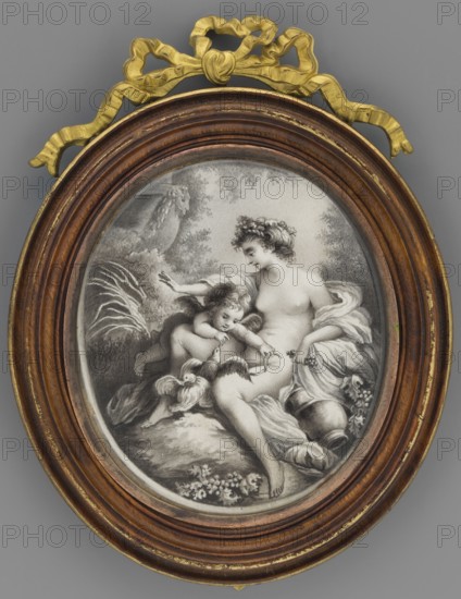 Venus and Cupid with doves in grisaille; painter Carl Gustav Klingstedt 1657–1734 and unknown painter; copies; antiquity; mythological scenes and symbols; Polish miniatures; Venus mythology in grisaille; Cupid mythology; doves; trees; leaves; flowers; children; figures; landscapes; dated 1730–1780; miniature; height 9.0 cm, width 8.0 cm, An oval framed artwork shows a grayscale scene of a seated woman and a child in a pastoral setting, enclosed in a wooden oval frame with a decorative golden ribbon ornament at the top. The woman is partly draped in flowing cloth and leans toward the child, who is perched beside her and reaches downward; both figures have soft, detailed features and curly hair. Nearby are a few birds, a rounded jug, and draped fabric, all set against a background of foliage and trees. The frame has warm brown wood tones with subtle gold accents and the ornamental ribbon is a bright gold color, while the central image is rendered in shades of black, white, and gray, with...