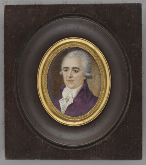 Portrait of a man in a purple tailcoat, bust three-quarters left. White wig; white cravat tied with a large bow, white vest with green stripes, purple tailcoat. Background brown, lighter greenish-sand around the head and left shoulder. Miniature, ca. 1900, France. Height 4.1 cm, width 3.7 cm. Frame: slightly recessed oval rim of gilded bronze in an oval recessed cut of a rectangular wooden frame, semi-polished bronze. Subjects: costumes, portraits en trois-quarts, men, male portraits, nobility, foreign miniatures., A painted portrait of an adult person with pale skin and powdered white hair set in an oval frame; the person wears a purple coat and a white ruffled garment at the neck, with a neutral facial expression and light-colored eyes. The portrait is surrounded by a decorative gold inner frame and a dark brown circular mat, all mounted on a rectangular dark wood panel that shows worn spots and scratches. The visible colors include white, purple, gold, dark brown, pale beige, and gr...