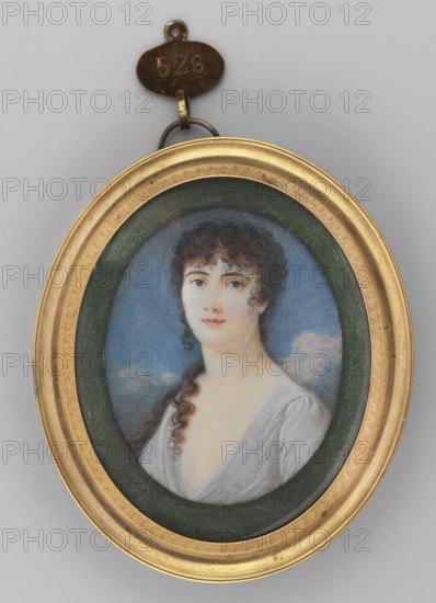 Portrait of a Young Girl, Restallino, Carlo 1776–1864, painter. Female portrait shoulder-length, young woman with braided hairstyle; three-quarter left bust. c. brown hair with a curling lock on the left shoulder, c. blue eyes, wearing a silvery-pink dress with a low neckline. Background of pink and c. grey clouds. Miniature, 1890; height 6.0 cm, width 4.8 cm. Binding: gilded bronze, convex rim, acanthus motif around the center. Repossession, An oval portrait in a gold frame hangs against a pale gray background; the frame surrounds a dark green inner ring and a painted oval scene showing a woman with pale skin and dark curly hair, some hair falling in a long curl over one shoulder; she wears a low-cut light gray or white dress and looks forward with a neutral expression; the painted background behind her is blue with pale cloud-like shapes; a small metal loop and an attached oval tag are visible above the frame in a darker metallic color.