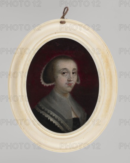 Portrait of a Young Woman, unknown artist, women, three-quarter portrait, headgear, female portrait, dress, foreign miniature, lace, bonnets, bust 3/4 right, c. blond hair smoothly combed, bonnet trimmed with white notched lace; black dress, deeply cut square neckline, wide white gauze collar from the neck, parted below, trimmed at the edge with two strips of notched lace. Background c. cherry. Binding: profiled oval ivory border. Label with stamped number on the reverse: 47 and p. 56. Miniature, height 8.9 cm, width 6.8 cm; dated c. 1650. Purchased for 150 marks in 1918., An oval frame in an off-white or cream color with slight discoloration surrounds an oval portrait; a loop of brown twine is attached at the top. Inside the frame, a painted bust of a person is visible against a deep burgundy or dark red background. The person has a fair complexion, dark brown hair styled close to the head with lighter wisps at the edges, and a neutral facial expression. They wear a gray garment with ...