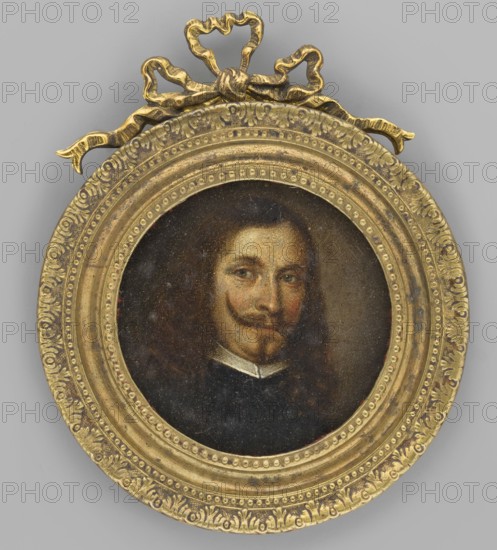 Portrait of a man, unknown artist. Miniature, bust 3/4 right. Hair chestnut brown, long, in curls below the shoulders; small beard; mustache curled upwards. Narrow white collar at the neck, black clothing. Background brown on the left and grey-olive on the right. Binding: round, recessed, slightly profiled bronze sheet frame, embossed with pearl ornaments and palmette motifs, bronze bow at the top. Illegible inscriptions on the back of the miniature and inside the binding; inscription on the board closing the binding: 1636., A circular framed portrait showing a person with long dark brown hair and a curled mustache and small beard, wearing a dark-colored garment with a light collar; the face has warm skin tones with subtle reddish and brown shading and a neutral expression. The round frame is ornate and metallic-looking in a gold color with decorative patterns and a bow-shaped ornament at the top in the same gold color. The background outside the frame is a flat gray color. The portrai...