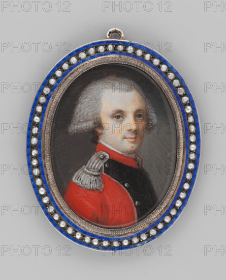 Portrait of an officer, unknown painter; soldiers epaulettes; young man; shoulder-length portrait; powdered wig hairstyle; male portrait, head turned slightly left; foreign miniature; provenance noted repossession, Jelenia Góra; dated 1780; miniature, height 3.4 cm, width 3.0 cm., An oval pendant with a painted miniature of a person wearing a red and black garment and a silver epaulet, the person has pale skin and powdered grey hair and a neutral facial expression; the miniature is set behind a glass cover and surrounded by a decorative double border featuring a blue enamel band and a row of small white bead-like elements, all mounted on a silver-colored oval frame against a light grey background.