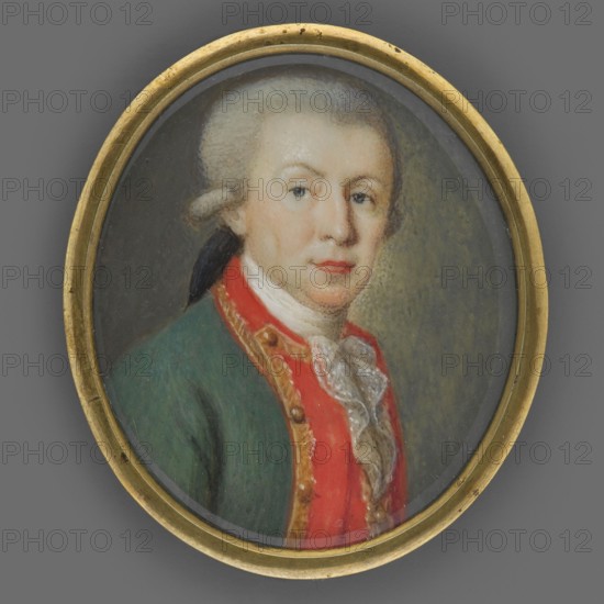 Landgrave Ludwig X of Hesse-Darmstadt 1753–1839, Grand Duke Ludwig I of Hesse, unknown artist, portrait bust, 3/4 right. Male portrait with grey wig with pigtail. Wearing green uniform tailcoat with red braided gold-edged collar, gold buttons, white cravat and white lace jabot. Background grey-olive, brighter on the right. Narrow brass rim binding. 1780, Germany. Miniature; height 4.0 cm, width 3.4 cm., An oval framed portrait of a person shown from the chest up wearing a green coat with a red front panel and gold trim, a white ruffled neckcloth, and a powdered wig tied at the back; the face has fair skin with light rosy cheeks and lips, pale blue eyes, and a neutral expression; the background is a muted gray-green and the frame is a worn gold color with small dark spots.