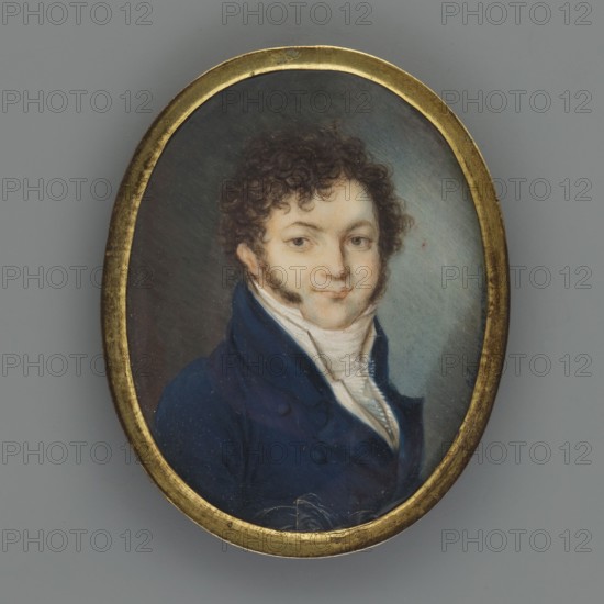 Portrait of a Man in a Navy Blue Tailcoat, Weixlbaum, Michael Johann 1790–1824, painter; busts, men, male portrait, Polish miniature; three-quarters portrait; 1812, Lviv; miniature; height 5.7 cm, width 4.5 cm, An oval framed miniature portrait showing a person from the chest up wearing a dark blue coat and a white high-collared shirt, with curly dark brown hair and sideburns, a fair complexion, and a faint smile; the painted background transitions from dark to muted bluish-gray, and the frame is a worn golden color.