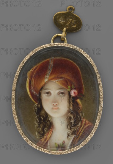 Odalisque, copy detail after Fr. Amerling; artist: Friedrich von Amerling 1803–1887; subject: odalisque / Orient, female portrait shoulder-length, left, woman with headgear turban; medium: miniature; dimensions: height 5.6 cm, width 4.5 cm; date: circa 1860–1880; provenance: repossession Jelenia Góra; place of origin: Vienna ., An oval pendant with a decorative gold-colored frame contains a painted portrait of a young woman wearing a large reddish-brown turban with a small pink flower and green leaves tucked to one side; she has pale skin, brown eyes, and long dark brown curly hair falling over her shoulders, and she wears a garment with warm tones including red and gold and a small green floral detail near her neckline; the pendant hangs from a small gold-colored ring and tag against a neutral gray background.
