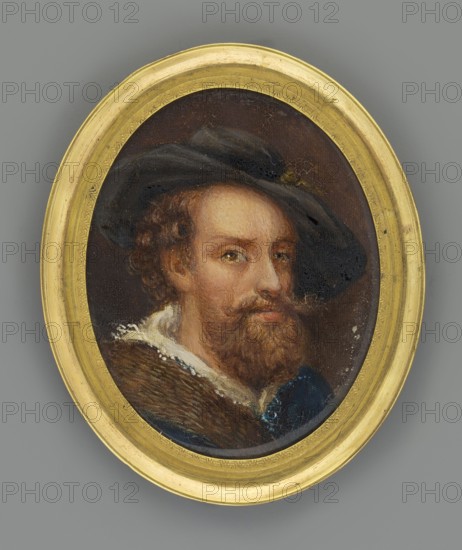Portrait of a Man in a Black Hat after Rubens?, unknown painter; three-quarter portrait; copy; head of a man wearing a hat; miniature; height 6.5 cm, width 5.4 cm; dated circa 1880?, An oval framed painted portrait of a man shown from the shoulders up wearing a dark hat tilted to one side and a fur-trimmed garment, with a beard and mustache and curly hair; the man has a neutral facial expression and light skin tones, and the painting surface shows a crackled texture; the frame is gold and the background around the portrait is gray.