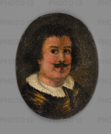 Portrait of a Man with a Spanish Moustache, unknown artist, male portrait, copy/foreign miniature, amateur hand, dated ca. 1850–1900? Bust slightly right. Straight black hair, slightly longer at the back, a few highlights on the forehead, black Spanish moustache, sunburnt face with a strong flush. At the neck, a white collar trimmed with a pleated ruffle, a golden-brown caftan wams. Background dark olive, slightly lighter on the right. Miniature; height 7.0 cm, width 5.4 cm. On the reverse a card with the inscription letter from the first quarter of the 20th century: N 70./Inventory. Binding: none., An oval painting of a person with short dark hair and a dark mustache, showing a face with pinkish and peach skin tones and slightly rosy cheeks; the person wears a white ruffled collar and a dark garment with brown and yellowish-gold highlights, all set against a dark brown oval background surrounded by a gray rectangular outer area.
