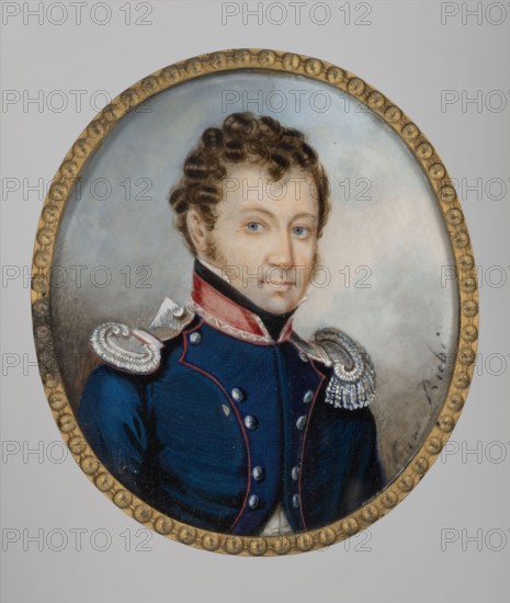 Lieutenant of the General Staff, unknown author, ca. 1810, Poland; miniature painting, height 8.2 cm, width 7.2 cm., An oval portrait of a man with light skin and curly brown hair wearing a dark blue military-style coat with red trim and metallic shoulder epaulettes, set against a pale gray-blue background and encased in a round gold-colored frame with a beaded pattern; visible colors include blue, red, brown, gold, gray, white, beige, and black.