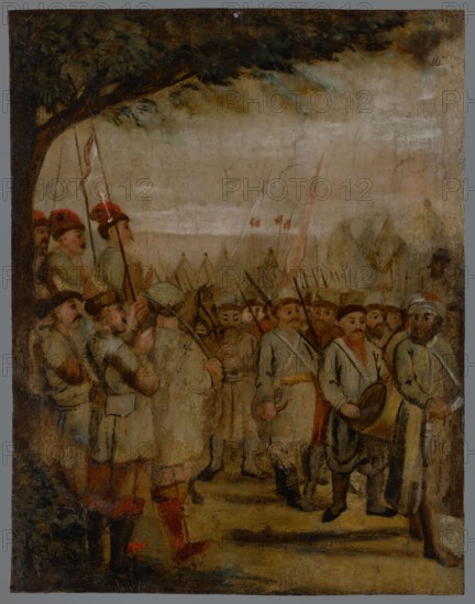 Military scene, unknown author role/classification of the creator, painter. The painting shows the march of Zaporozhian infantry. 17th century, painting, height 32.5 cm, width 25 cm., A painted scene shows a group of people gathered outdoors beneath a large leafy tree with dark green and brown foliage at the top left; the sky is a muted mix of beige and gray tones. The figures wear garments in shades of beige, cream, gray, brown, and touches of red, with some hats and head coverings in red and white; a few figures hold long poles or spears that are dark brown or black. Several faces with varied expressions are visible, depicted in pale flesh tones with darker hair and beards. In the foreground, a figure wears bright red stockings and another has a drum in brown and yellowish tones. The ground is rendered in earthy browns and ochres, and there are hints of green foliage at the lower left. The overall palette is subdued with browns, beiges, grays, muted greens, and small accents of red.