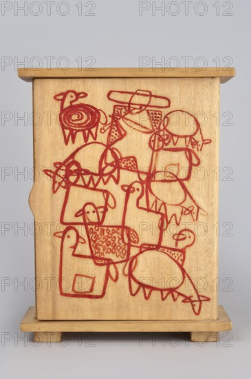 Wardrobe from a set of doll furniture, single-door wooden wardrobe with painted decoration covering the outer surface of the door — composition presenting a silhouetted flock of sheep with a shepherd figures overlap, creating a graphic ornament. 1947–1948. Zakopane. Toy. Height 22 cm; width 17 cm; depth 7 cm. Maker: Kenar, Antoni 1906–1959, sculptor. Co-creators: State Secondary School of Fine Arts in Zakopane; Office of Production Aesthetics Supervision Warsaw., A wooden box with a light natural wood tone stands against a neutral pale gray background; its front panel is decorated with a continuous, hand-drawn red line forming a playful arrangement of stylized animal and abstract shapes, including several rounded bodies, a few horn- or ear-like protrusions, looped limbs, and patterned textures made of repeated small shapes, all sketched in the same red color; the box has a flat top and base with short block feet, and the wood grain is visible across the surface.