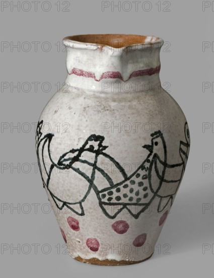 Jug with a handle with zoomorphic decoration: procession of hens. Maker: Antoni Kenar 1906–1959, sculptor; co-creators: Office of Production Aesthetics Supervision Warsaw; 1947–1949 and State Secondary School of Fine Arts in Zakopane Zakopane; est. 1876. Materials/technique: ceramics, painted decorations; style/features: zoomorphic representations, linear patterns, unique item. Date: 1949; place of origin: Zakopane. Function/type: vessel jug with handle. Dimensions: height 18.5 cm; width 13.8 cm; depth 16.0 cm., A ceramic jug with a rounded body and a slightly flared rim sits against a plain gray background; the jug's exterior is mainly off-white with a slightly speckled, textured surface and an interior that is a warm brown. A hand-painted dark green band of stylized bird-like figures wraps around the middle, showing simple outlines, dots, and curved shapes, while a row of irregular reddish-pink dots decorates the lower portion and a wavy reddish-pink band encircles the neck. The rim ...