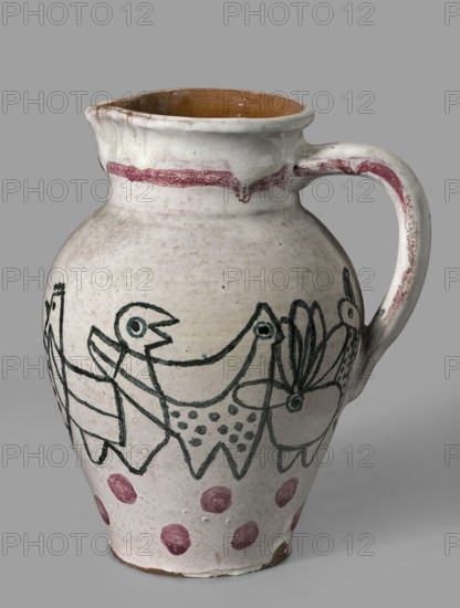 Jug with a handle with zoomorphic decoration: procession of hens. Makers/creators: Office of Production Aesthetics Supervision Warsaw; 1947–1949 co-creator; State Secondary School of Fine Arts in Zakopane Zakopane; 1876–, co-creator; Kenar, Antoni 1906–1959 author, sculptor. Materials/technique: ceramics, painted decorations, linear patterns; zoomorphic representations; unique item. Date: 1949. Place of origin: Zakopane. Function/type: vessel. Dimensions: height 18.5 cm, width 13.8 cm, depth 16.0 cm., A ceramic pitcher with a rounded body, narrow neck, pouring spout, and a curved handle; the exterior glaze is mostly off-white with visible wear and a brownish interior; a reddish band decorates the rim and appears along the handle and near the base as a row of polka dots; a dark green linear drawing wraps around the body depicting stylized bird and floral shapes connected in a continuous motif; the surface shows small blemishes, crackle in the glaze, and areas of uneven coloration in whi...