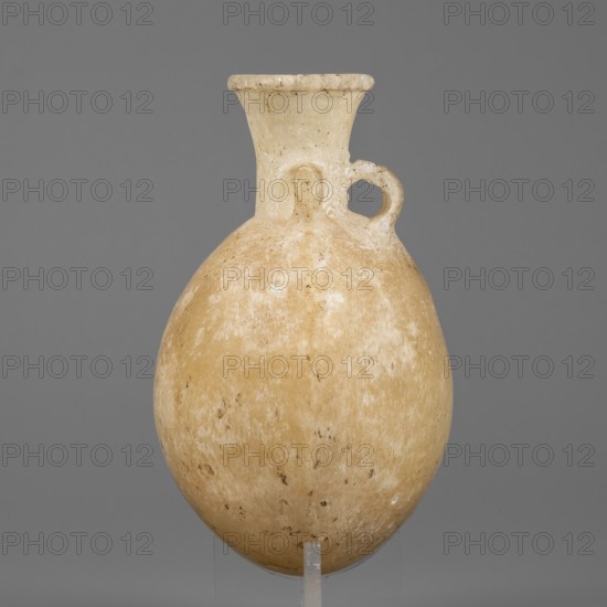 Flask-shaped vessel, pilgrim flask with a spherical, flattened belly, narrow high widening neck and three small ring-shaped handles; stone; ca. 1550–1186 BC, New Kingdom, 18th–19th Dynasty, Egypt; height 8.8 cm, width 6.1 cm, weight 0.15 kg., A single rounded vessel with a narrow neck and flared rim sits against a plain gray background, the body showing a mottled surface in shades of beige and off-white with some darker brown speckles; a small looped handle near the neck connects to the shoulder, and the rim and neck appear lighter in color with subtle surface texture.