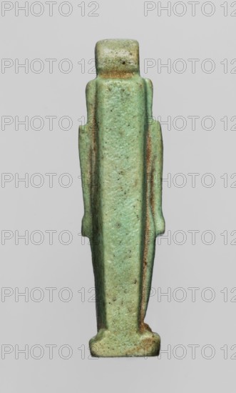 Amulet — god Thoth; object made of green faience; Late Period, Egypt 664–332 BC; amulet; height 5 cm, width 1.3 cm; depiction of Thoth Egyptian deity, Egyptian religion., A slender vertical figurine viewed from the front with a simplified blocky human form, featuring a rounded head, narrow shoulders, straight sides, and a tapered body standing on a small rectangular base; the surface shows a worn, slightly mottled texture with visible pitting and irregularities; colors visible include pale green, light turquoise, muted brown, and small areas of darker green and tan, with brownish worn edges and speckling across the surface.