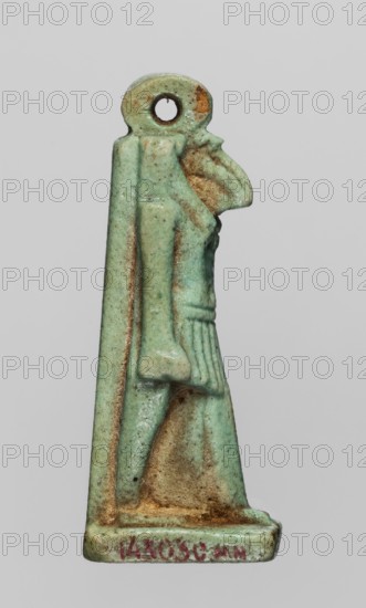 Amulet — god Thoth;, Thoth mythology, Egyptian deities, Egyptian religion; object made of green faience; Late Period, Egypt, 664–332 BC; amulet; height 5 cm, width 1.3 cm., A small carved pendant-like object shaped like a standing figure with a rounded head that has a circular hole, showing a stylized profile with a prominent curved beak-like nose and a draped garment; the surface is predominantly pale green with areas of darker green and light brown discoloration and some tan or ochre patches, and there are traces of reddish coloration near the base.