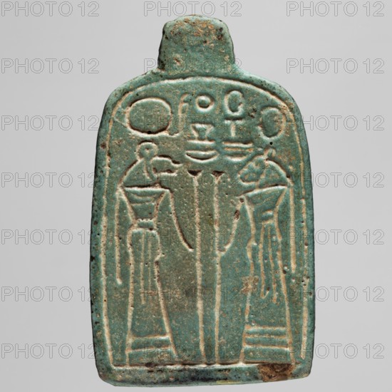 Amulet — stele with lion-headed goddesses Bastet and Sekhmet?, lionesses, Egyptian deities, Sekhmet mythology, Bastet mythology, Bes mythology, thrones; ca. 747–525 BC 25th–26th Dynasty, Egypt; amulet; height 7.1 cm, width 4.6 cm., A rectangular, rounded-top object with a small tab at the top, shown against a neutral background, predominantly turquoise with areas of lighter green and brownish wear; its surface is carved with a recessed rectangular border and inside that border are a few vertical raised forms and a group of carved, stylized figures or shapes that include curved and rounded heads, elongated bodies, and flaring bases, all highlighted by lighter, worn edges where the underlying material shows through; the piece has small dark speckles and patches of brown discoloration, and the bottom edge shows a darker worn area.