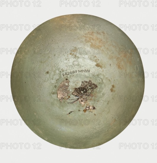Bottle, unknown eastern workshop, Goluchów Greater Poland Voivodeship, 3rd century, vessel, height 7 cm, width 8.5 cm, A round, dome-shaped object with a textured surface showing worn areas and peeling layers in muted green, pale green, brown, rust, and gray tones, with a patch of darker brown and black flaking material near the center and subtle scuffed spots and scratches scattered across the surface.