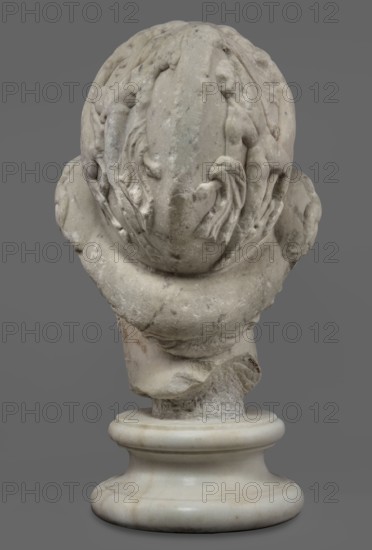 Head of Menelaus from the Menelaus Carrying the Body of Patroclus group, Head of a bearded man wearing a helmet, with an expressive face shown by wide-open eyes and a parted mouth, emphasized by chiaroscuro effects from the contrast between the artistically designed lush locks of beard and hair emerging from under the helmet and the smooth skin of the face — the face of a man experiencing dramatic moments. The helmet is adorned with relief decoration depicting fantastic creatures: on each side a centaur fighting a Greek, and below on the edge a triton figurine. The sculpture is a Roman copy of the head from a Hellenistic bronze composition depicting Menelaus with the body of Patroclus. Menelaus, Helen's husband, is the first to fight to retrieve the deceased's body and then carries it from the battlefield so it can be buried according to ritual. The death of Patroclus, Achilles' friend, is an important moment in the Trojan War, bringing Achilles back into the fight and significantly in...