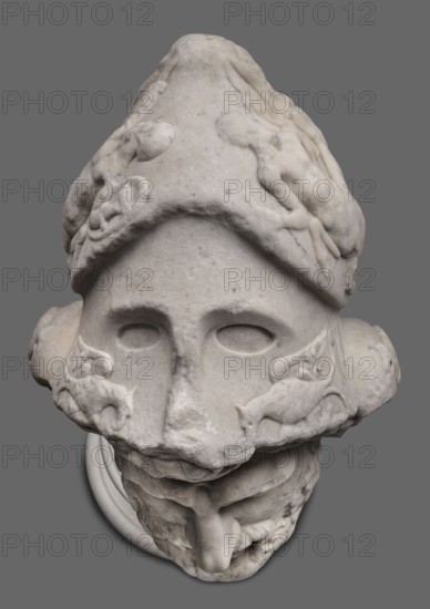 Head of Menelaus from the Menelaus Carrying the Body of Patroclus group, unknown artist. Head of a bearded man wearing a helmet, with an expressive face shown by wide-open eyes and parted mouth, emphasized by chiaroscuro effects from the contrast between lush locks of beard and hair emerging from under the helmet and the smooth skin of the face—the visage of a man experiencing dramatic moments. The helmet is adorned with relief decoration depicting fantastic creatures: on each side a centaur fighting a Greek, and below on the edge a triton figurine. The sculpture is a Roman copy of the head from a Hellenistic bronze composition depicting Menelaus with the body of Patroclus. Menelaus, Helen's husband, is depicted retrieving and carrying Patroclus's body after his death—a key episode in the Trojan War. Commonly reproduced in Roman sculpture. Dated to the 1st half of the 2nd century AD reign of Hadrian, 117–138. Roman Empire; sculpture; weight 78.5 kg., A stone sculpture of a head shown a...