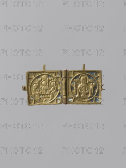Diptych: Old Testament Holy Trinity and the Mother of God Znamienije, Old Believers' workshop; Mary mother of Jesus Christ; the Mother of God Znamienije iconographic; the Holy Trinity iconographic; angels; diptychs; the Mother of God with the Child iconographic; tree iconographic; mountain iconographic; inscriptions; Old Believers; maphorion iconographic; deposit; gift; Golgotha iconographic. On the two wings of the diptych there are images of the Mother of God with Christ Emmanuel on her breast in a round medallion, and three angels sitting behind a trapeze. Identifying inscriptions are placed on both sides of the images. Dimensions: 3 x 3.7 x 2; height 3 cm, width 7.5 cm. Date: 18th–19th century. Origin: Russia. Object type/material: icon, diptych. Weight: unknown., A small hinged metal diptych opened to show two square panels with circular framed relief scenes, one panel depicting a group of figures seated around a central element and the other showing a single seated figure within ...