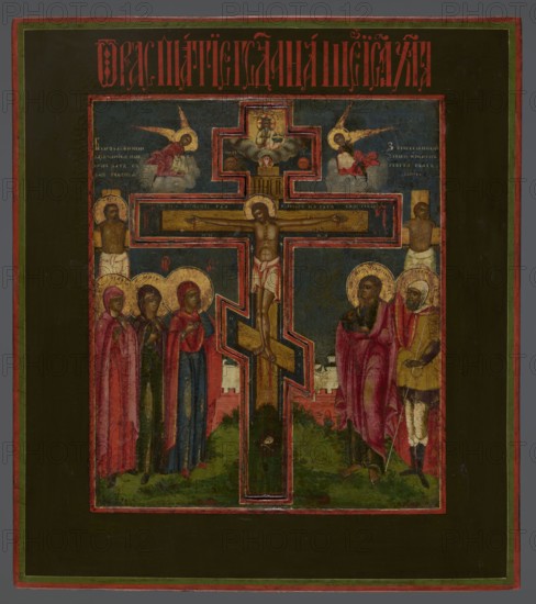 Icon: Crucifixion of Christ on Golgotha, Old Believers workshop. In the center a recessed eight-pointed wooden cross depicts Christ stretched out. Above are God the Father and the dove of the Holy Spirit. To the left of the cross: Mary, the mother of Christ, and two women; to the right: St. John and the centurion Longinus. Behind them are the two thieves on crosses. In the upper part angels in the clouds turn toward the Crucified One, with cloth covering their hands. Background shows the symbolic walls of Jerusalem and a view of the city. Colors are rich, contrasting, and realistic; a striking dark blue sky. Inscriptions in white paint are visible in the upper corners; an identifying inscription in vermilion is placed in the upper field. 18th century, Wietka workshop; icon; height 49.5 cm, width 44.3 cm., A painted panel showing a central crucifix with a body on the cross, outlined by a bold border, set against a dark blue background within a rectangular frame; on the left side of the ...