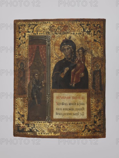 Icon: Mother of God, Unexpected Consolation; Orthodox workshop; Unexpected Consolation iconography; saints; icons; Mary mother of Jesus Christ; man; Jesus Christ Bible; inscriptions; Mother of God and Child iconography; halo iconography; canopy beds; sinners. The icon depicts a bearded man kneeling and stretching out his hands in prayer to the image of the Mother of God and Child. Christ holds both hands to his chest while the Mother of God turns her face toward the man. Below the icon is the inscription: Unexpected consolation of the Most Holy Theotokos. A certain ungodly man, having a daily rule to pray to the Most Holy Theotokos... In the background a bourgeois interior with a window and curtains can be seen, characteristic of provincial icon painting of the 19th and 20th centuries. Unidentified saints are depicted on the icon's fields. The image is framed by an embossed geometric and floral pattern. The treatment of the interior and figures demonstrates the influence of Western pat...