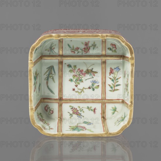 Vessel, Chinese, Qing dynasty Daoguang, 1821–1850, porcelain, colored; decorated on the outside with lambrequin ornament, floral decorations, and meander strip. Vessel; height 6.0 cm, width 12.8 cm., A square ceramic dish with rounded corners and a pale green interior divided visually into a grid by raised golden lines, each panel painted with delicate floral and insect motifs in colors including pink, green, blue, red, and gold, with the gold rim showing around the top edge and a reflection of the dish visible on a smooth gray surface; the background behind the dish is solid gray.